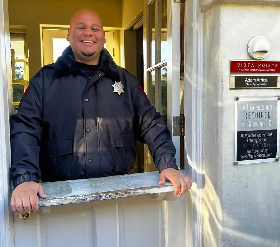 A man standing in front of a door.