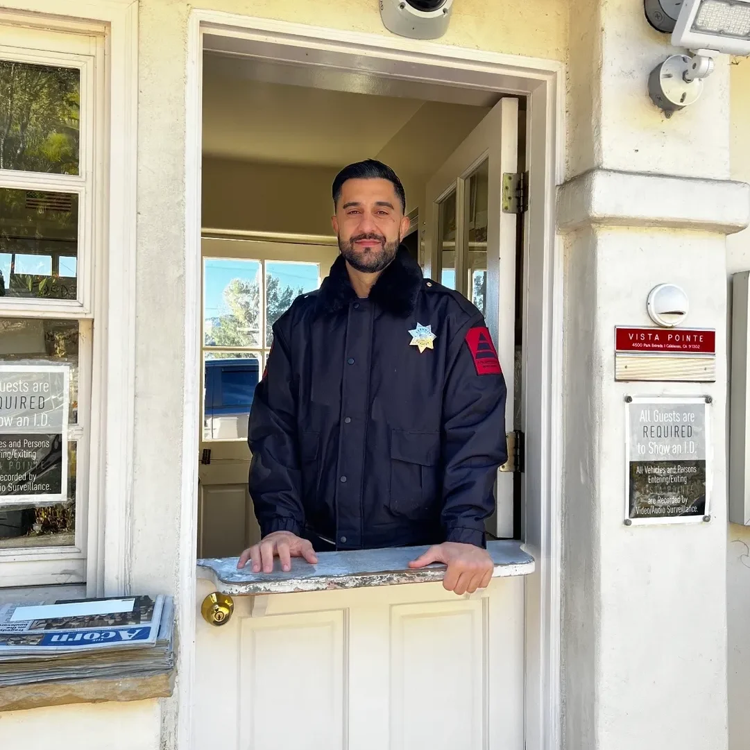 A man standing in front of a door.